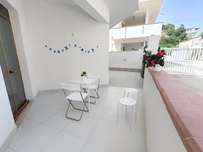 a room with a bed with towels on it at Per Famiglie ed Amici a 3 minuti a piedi dal mare Rosso Corallo Alcamo Marina in Alcamo Marina