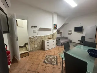 a large living room with a couch and a bed at Fabian Appartament in Bagheria
