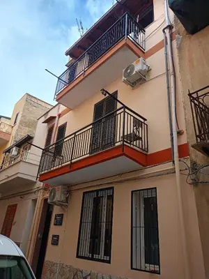 a building with balconies on the side of it at Fabian Appartament in Bagheria
