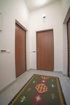 a washer and dryer in a small bathroom at Adenzia apartment in Palermo