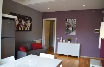 a living room with a couch and a table at New Palermo Holidays Penelope in Mondello