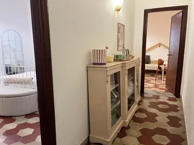a bathroom with a white sink and a mirror at Casassud in Palermo