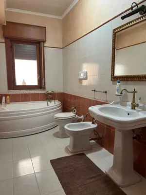 a kitchen with a stove and a microwave at Casa Verdi in Corleone