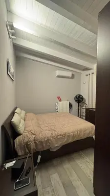 a bedroom with a bed in a room at Brezza Marina apartment in Carini