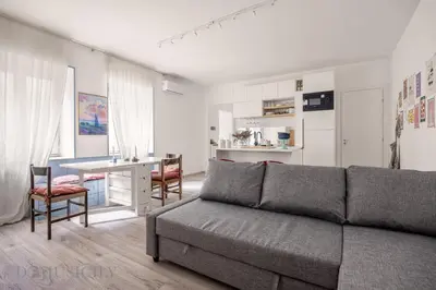 a living room with a couch and a table at Loggiato dei Ventimiglia By DomuSicily in Palermo