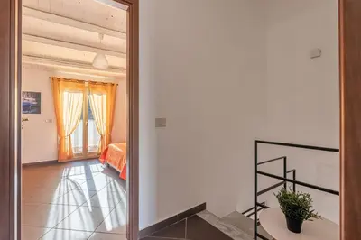 a mirror in a room with a bedroom at Casa Peppa by Wonderful Italy in Palermo