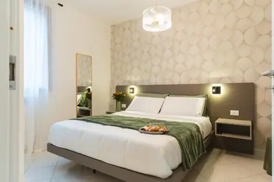 a bedroom with a large bed with a bowl of fruit on it at Dimora d'incanto al Capo in Palermo