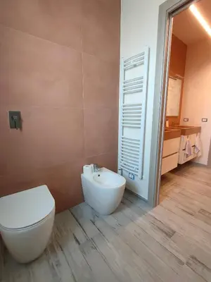 a bathroom with a toilet and a sink at Brezza Marina in Alcamo