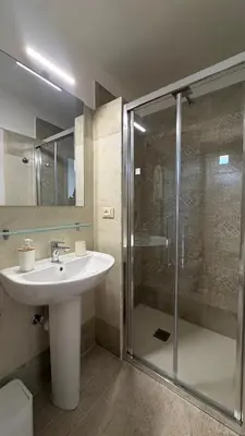 a bathroom with a sink and a mirror at Albergo Cavour in Palermo