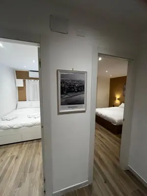 a room with two beds and a mirror at A CASA DI LILLY - BALLARò' - in Palermo