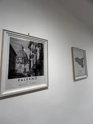 a picture on a wall with a picture of a building at A CASA DI LILLY - BALLARò' - in Palermo