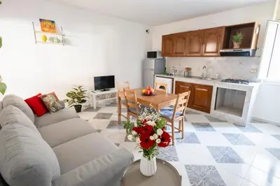 a living room with a couch and a table at iFlat Casa Sant'Agata in Palermo