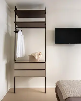 a bedroom with a dresser with a mirror and a bed at Casa Marella in Balestrate