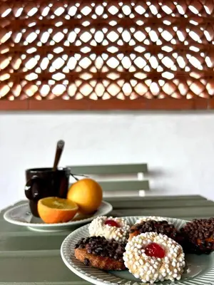 two plates of food with fruit on a table at Casa del Teatro in Palermo