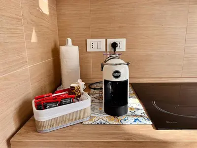 a coffee maker sitting on a counter in a room at Auri's home in Palermo