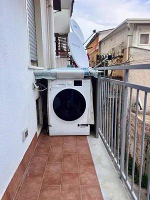 a washing machine on the balcony of a house at Auri's home in Palermo