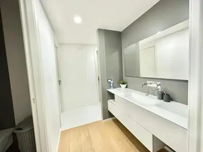 a bathroom with a white sink and a mirror at Villa With Citrus Grove Near Caccamo in Termini Imerese