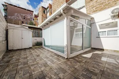 a patio with a sliding glass door on a building at La Casetta di Simo & Leo in Palermo