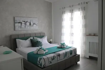 a bedroom with a bed with towels on it at Villa del sole in Carini