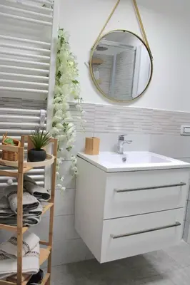 a bathroom with a sink and a mirror at Villa del sole in Carini