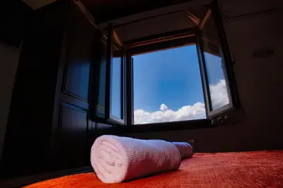 a towel laying on the floor in front of a window at Agriturismo Case Varisco in Altavilla Milicia