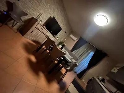 an overhead view of a living room with a couch and a television at Enza HOUSE in Balestrate