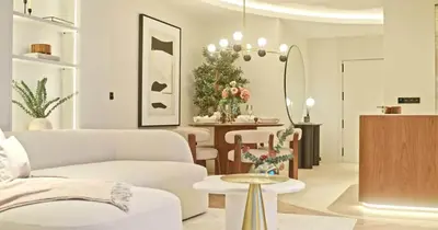 a living room with red chairs and a chandelier at Bella Vista Residence in Palermo