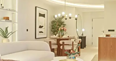 a room with chairs and a table and a chandelier at Bella Vista Residence in Palermo