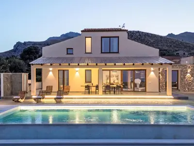 a villa with a swimming pool in front of a house at Villa Cleope by Interhome in Castellammare del Golfo