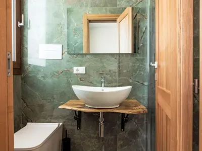 a bathroom with a sink and a mirror and a toilet at Villa Cleope by Interhome in Castellammare del Golfo