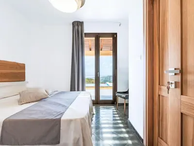 a bedroom with a bed and a view of the ocean at Villa Cleope by Interhome in Castellammare del Golfo