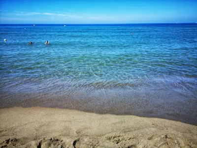 a group of people swimming in a large body of water at Holiday Home Villa mit Wasserblick by Interhome in Cefalù