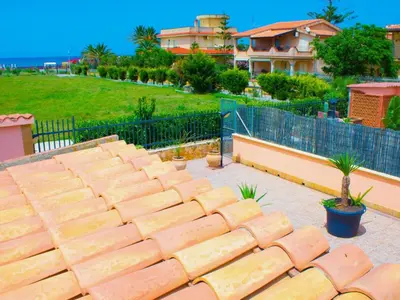 a set of brick steps in front of a house at Holiday Home Helle mediterrane Villa mit Veranda und Garten by Interhome in Cefalù