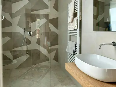 a bathroom with a white sink and a shower at Sustainable Villa With Infinity Pool in Castellammare del Golfo