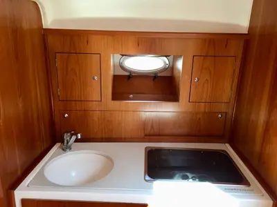 a small bathroom with a sink and a mirror at Palermo Boat Experience in Isola delle Femmine