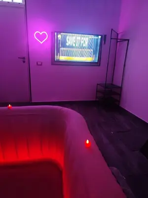 a room with a bed and a sign that says save it up at Magic House in Palermo