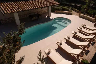 an overhead view of a swimming pool with lounge chairs at Exclusive Villa Eden in Castellammare del Golfo