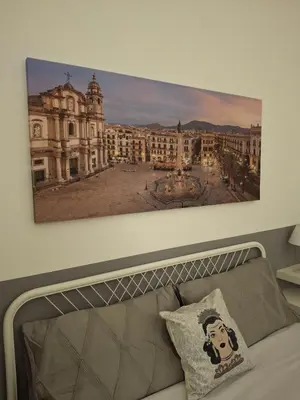 a painting on the wall above a couch at Compa House - Palermo Center in Palermo