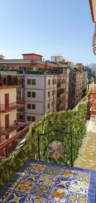 a bench sitting on top of a balcony at Magia del Sud in Palermo