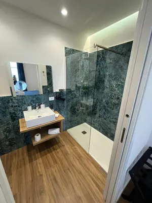 a bathroom with a sink and a shower at Maison Butera in Palermo