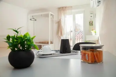 a counter top with a plant and a mirror at Vicoloft al Capo in Palermo