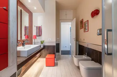 a bathroom with two sinks and two toilets at Sunny Suite Palermo in Palermo