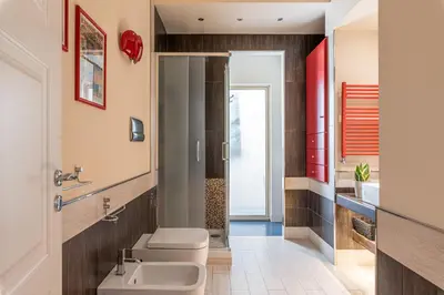 a bathroom with a toilet and a sink at Sunny Suite Palermo in Palermo