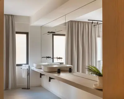 a bathroom with two sinks and a large mirror at Idro Luxury Suite in Palermo