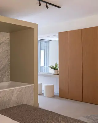 a room with a large wooden cabinet and a window at Idro Luxury Suite in Palermo