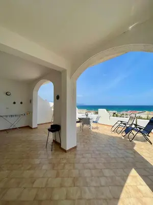 a living room with a view of the ocean at Sea view terrace house in Alcamo
