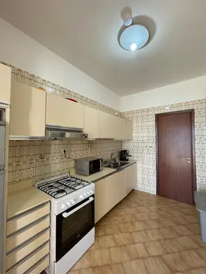 a kitchen with a stove top oven in a kitchen at Sea view terrace house in Alcamo