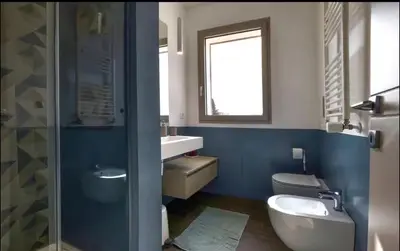 a bathroom with a toilet and a sink at Nereide home 350 sqm with large garden in Balestrate