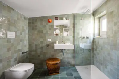 a bathroom with a toilet and a sink and a shower at Casa Dara By DomuSicily in Palermo