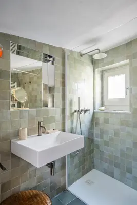 a bathroom with a sink and a mirror at Casa Dara By DomuSicily in Palermo